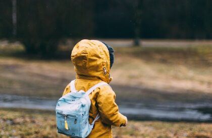 Photo by Daiga Ellaby shallow focus photo of toddler walking near river